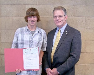In June, Mark Witzel (r), chapter president, presents a $1,000 scholarship to Derek Bosman, High Tech High School, North San Diego County. Bosman will study mechanical engineering at California State University-Fullerton.